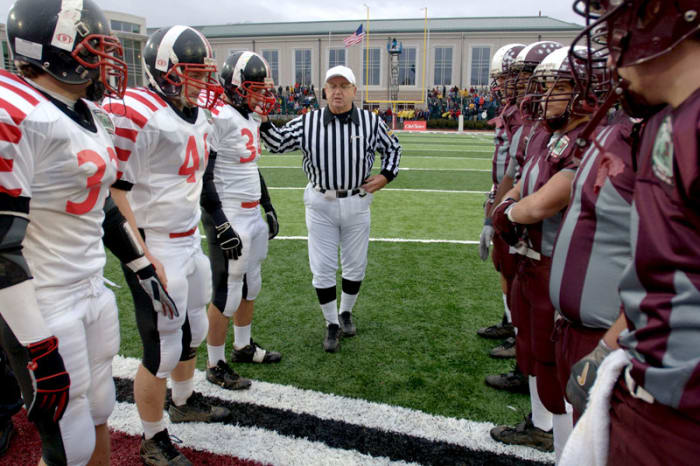 Easton and Phillipsburg captains met before the 2006 Thanksgiving game, the 100th anniversary of the rivalry. (Peter Turnley for Sports Illustrated)
